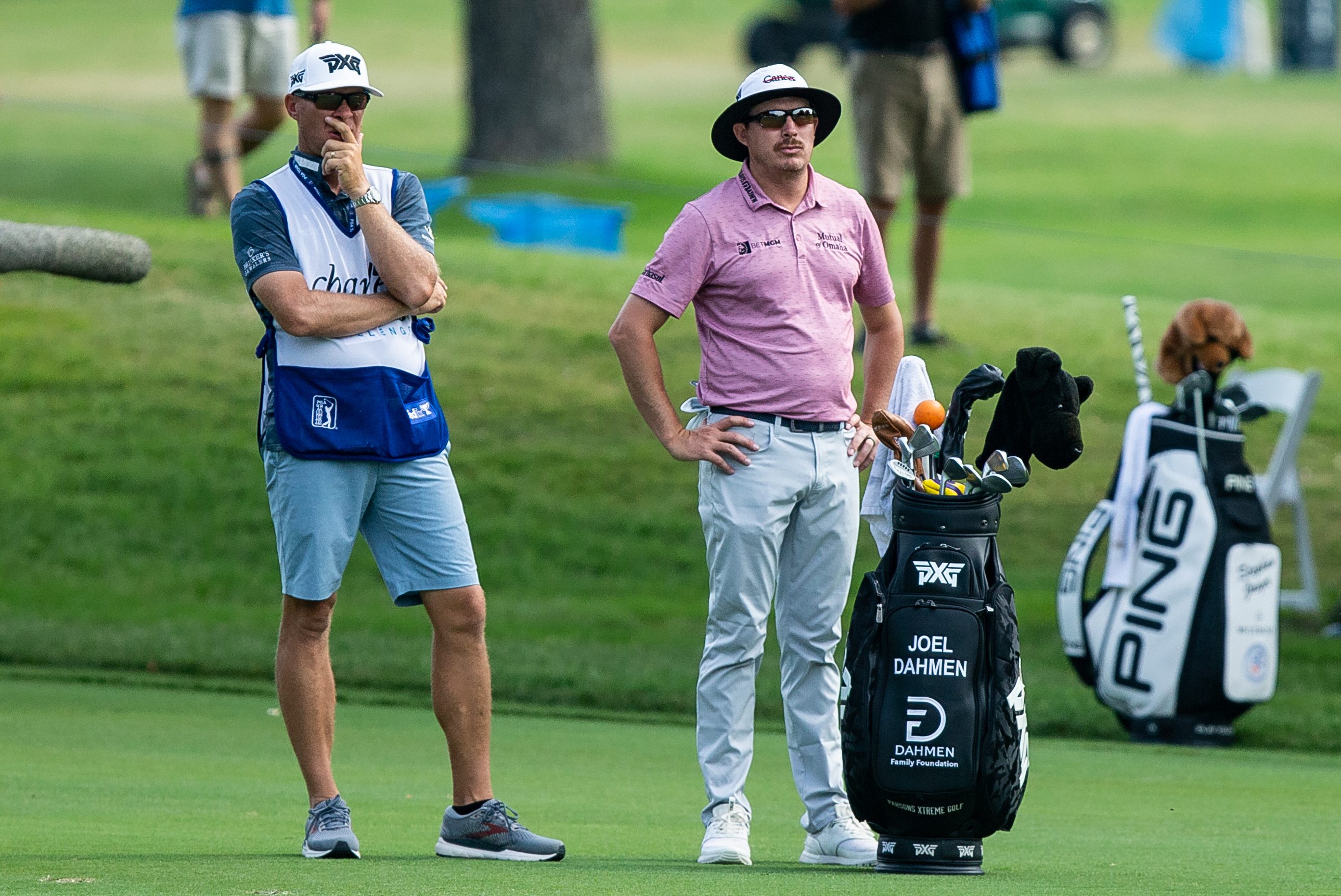 Joel Dahmen stands with his caddie Geno Bonnalie at the Charles Schwab Challenge.