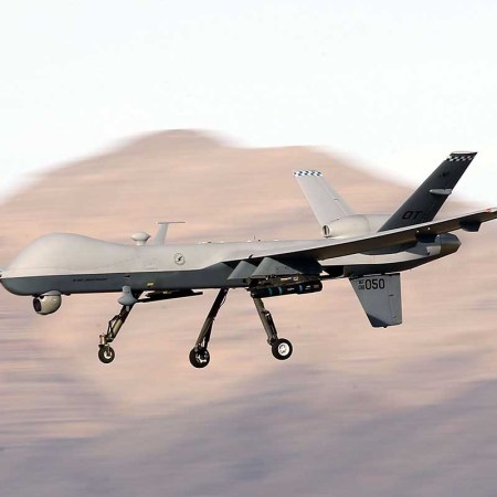 An MQ-9 Reaper remotely piloted aircraft (RPA) flies by during a training mission at Creech Air Force Base on November 17, 2015 in Indian Springs, Nevada. The Air Force denies an AI drone "killed" its human operator during a simulated mission.
