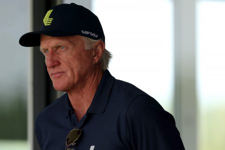 LIV Golf CEO Greg Norman watches from a suite on the 18th green.