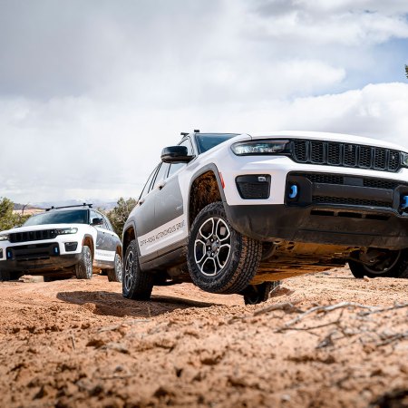 Two Jeep Grand Cherokee 4xe SUVs with autonomous off-road tech driving in Moab, Utah