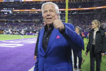 New England owner Robert Kraft gives fans a thumbs up before a game.