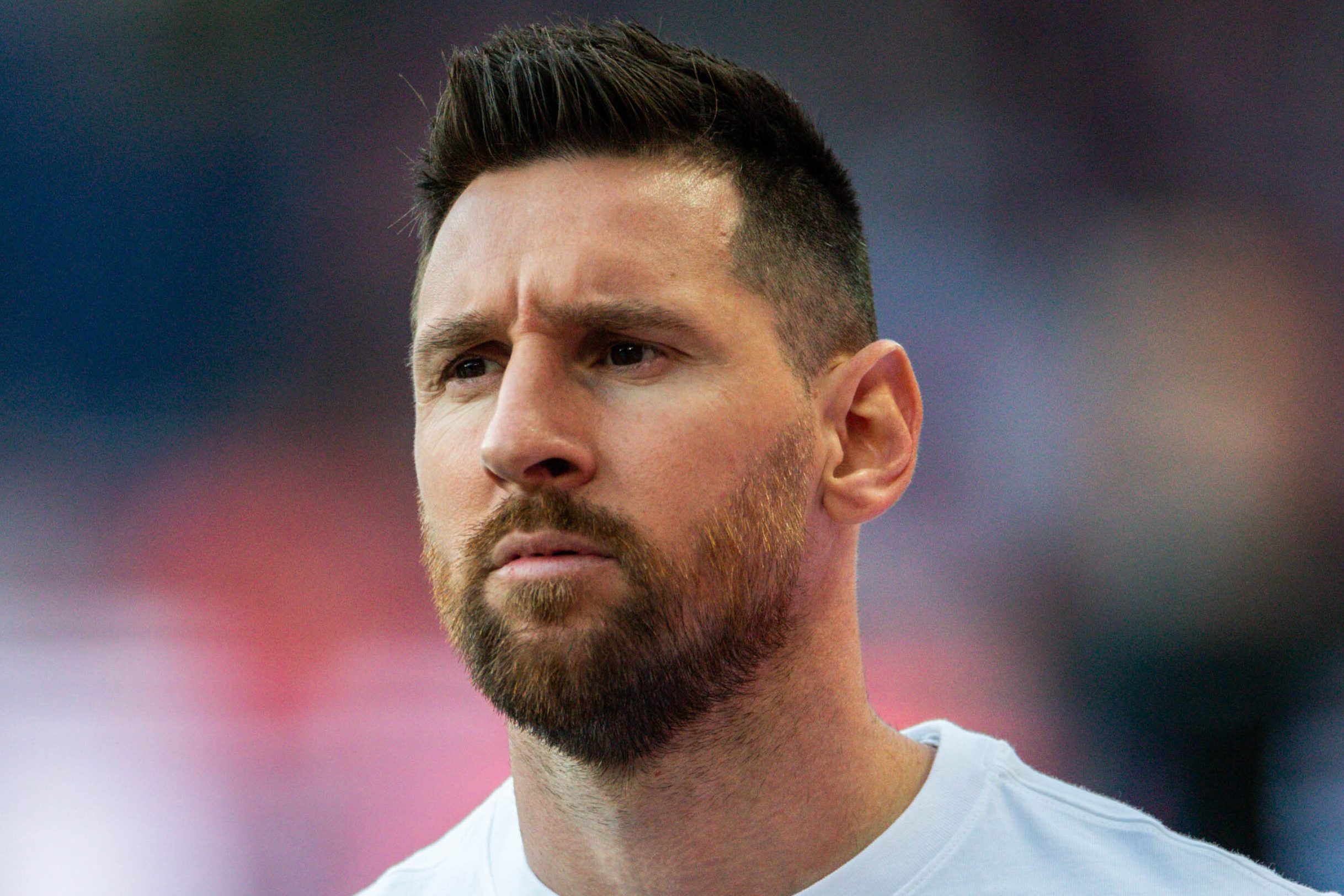 Lionel Messi warms up before a French league soccer match.
