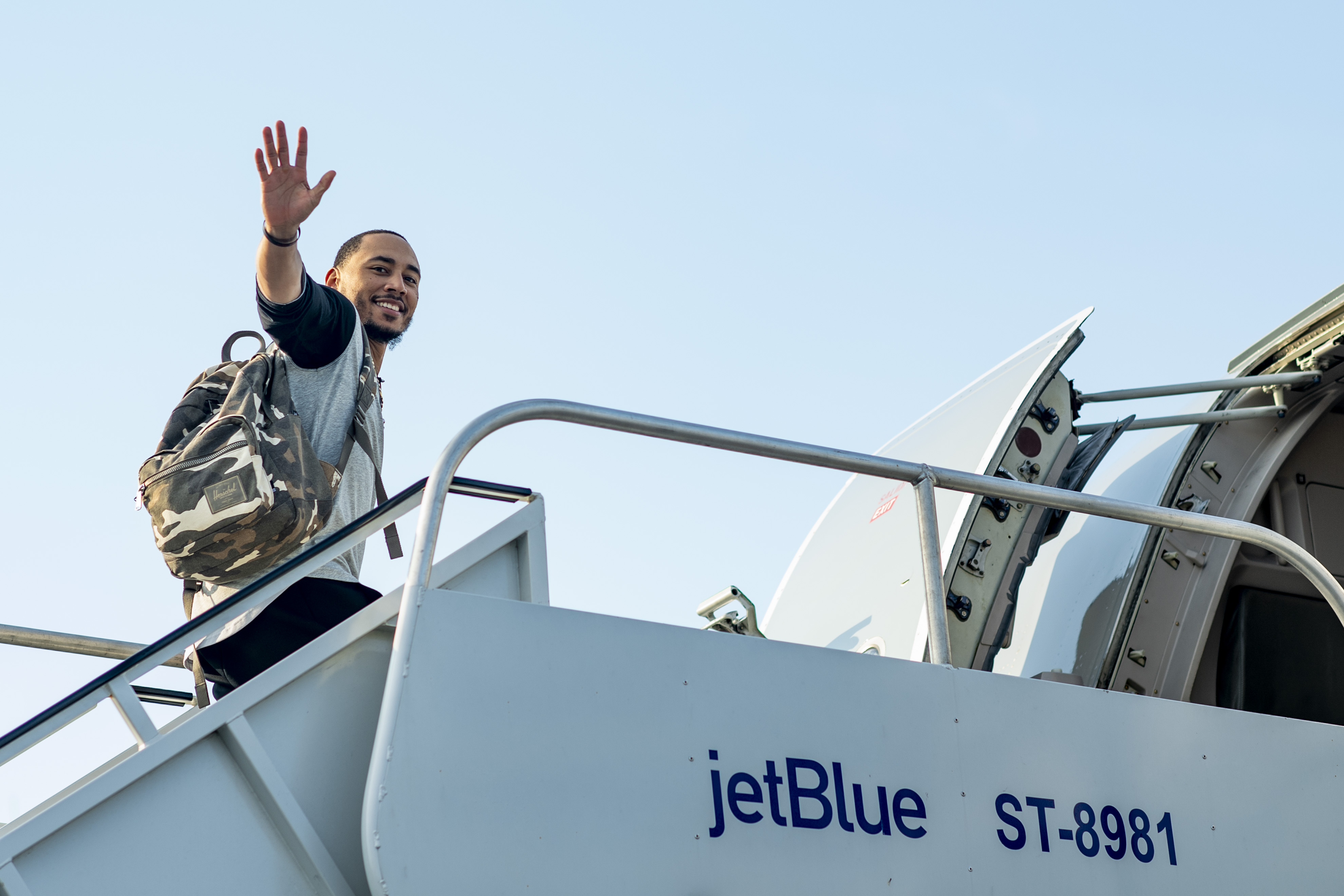 Mookie Betts boarding a flight on way to a road trip.