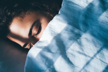 A young lady napping in the middle of the day.