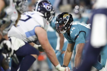 Travon Walker of the Jaguars lines up before a play against the Titans.