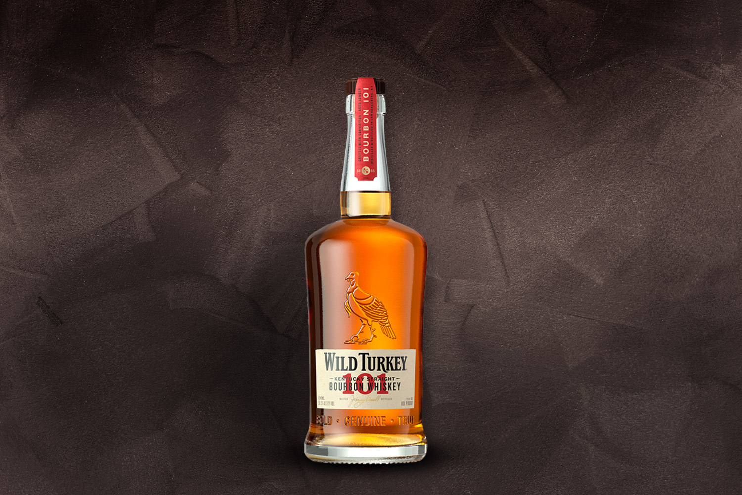 a bottle of wild turkey 101 on a grey background