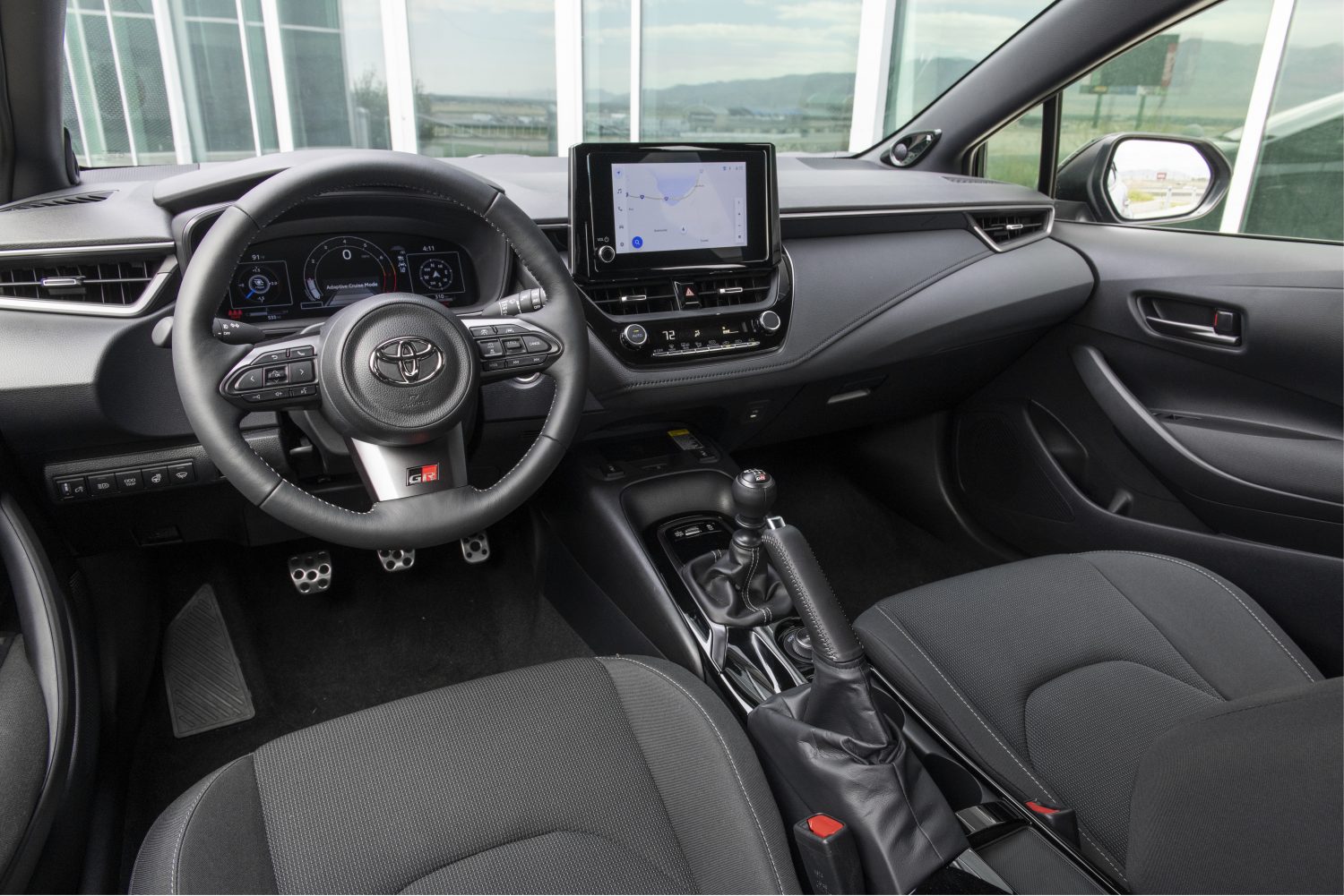 The dashboard and front interior of a 2023 Toyota GR Corolla