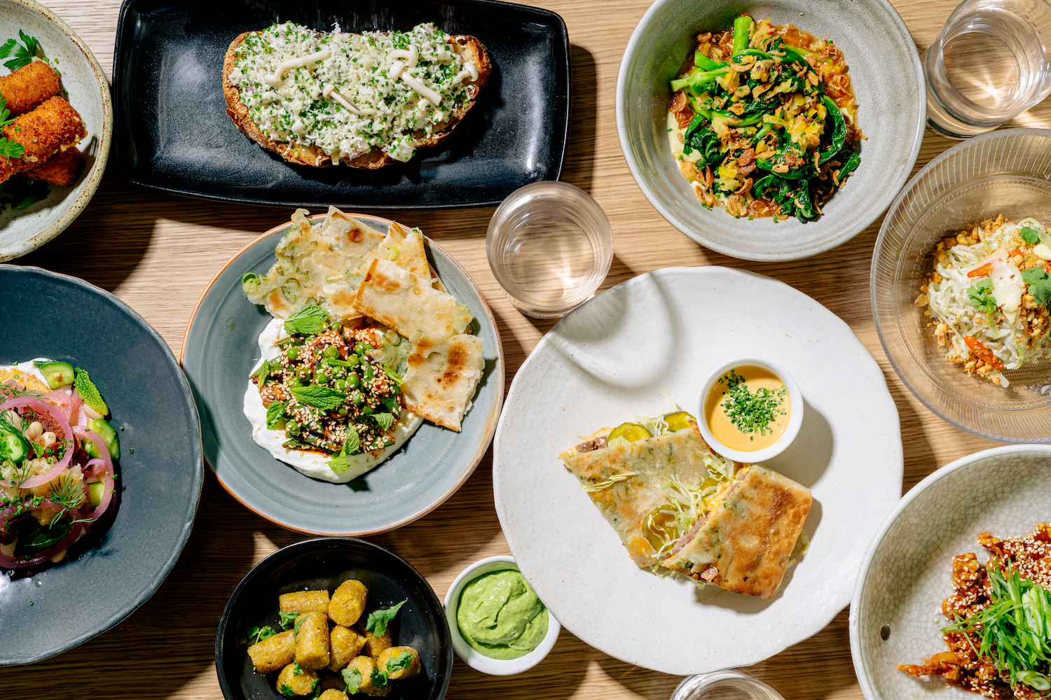 table with plates of food.