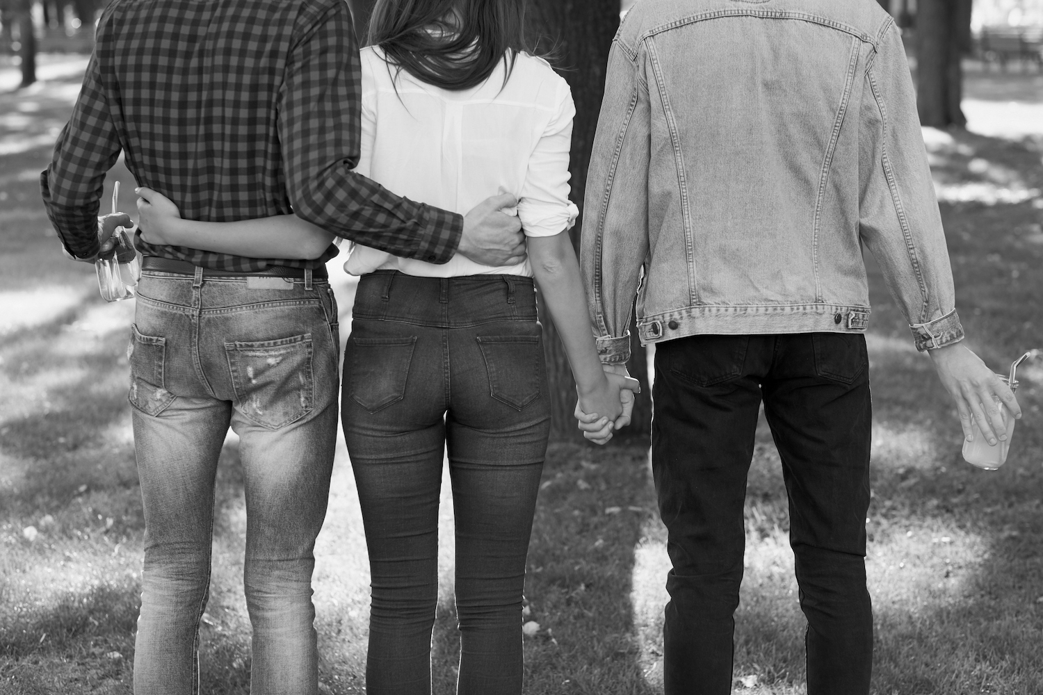 Young woman in relationship with two men