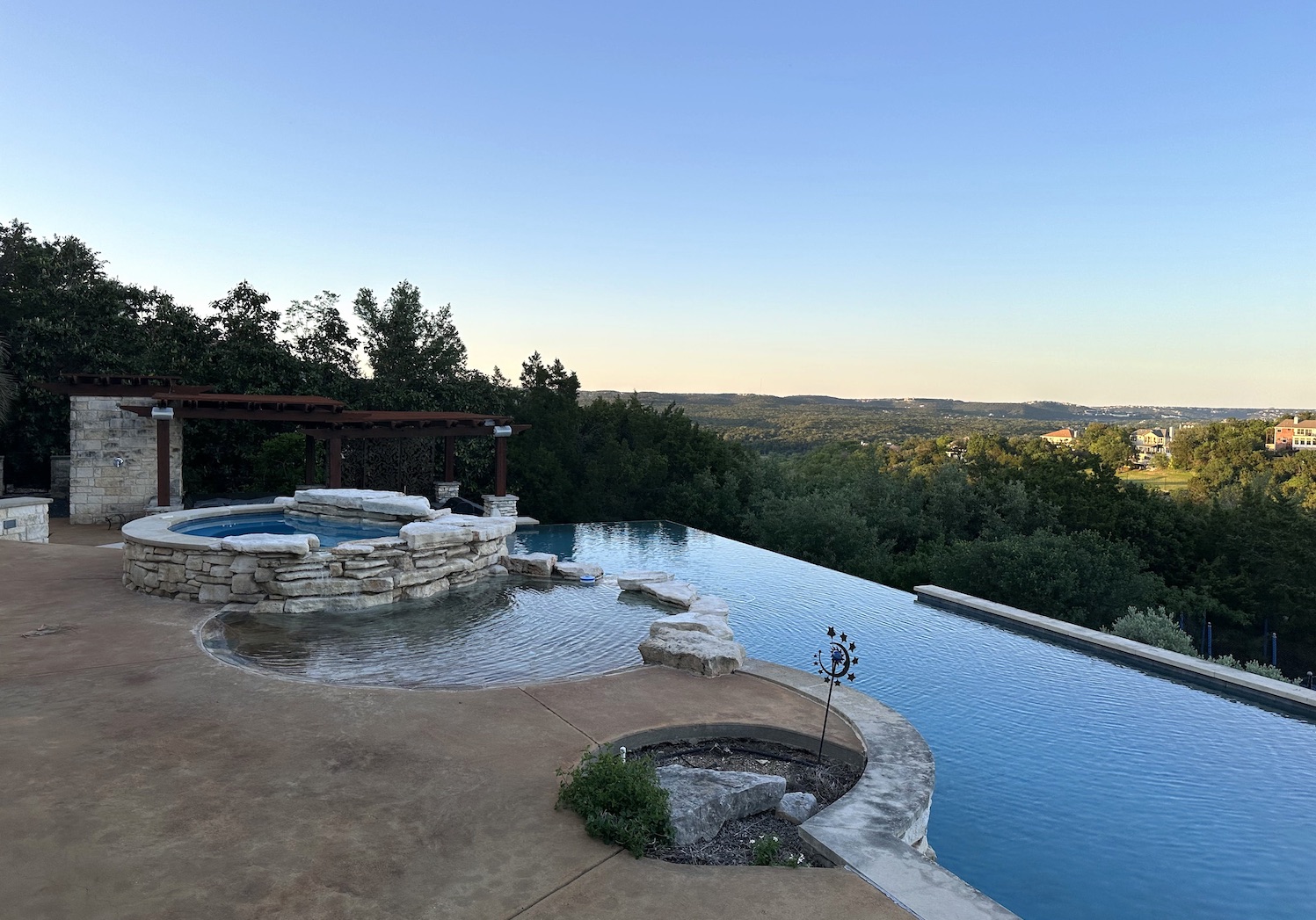 infinity edge pool next to a hottub