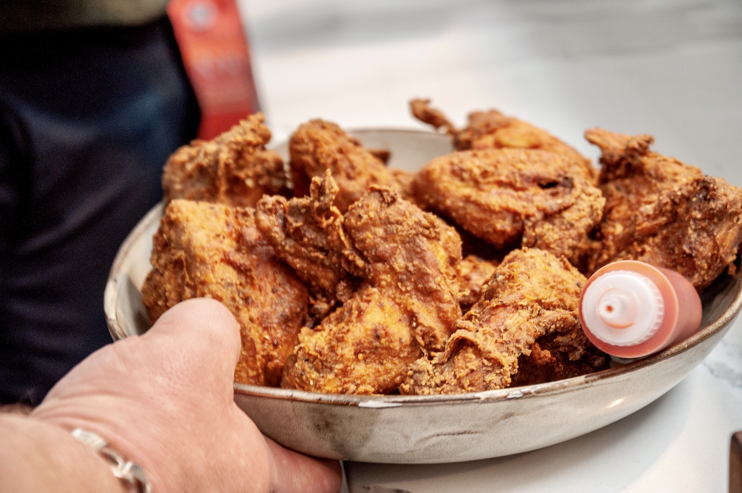 A bowl of fried chicken.