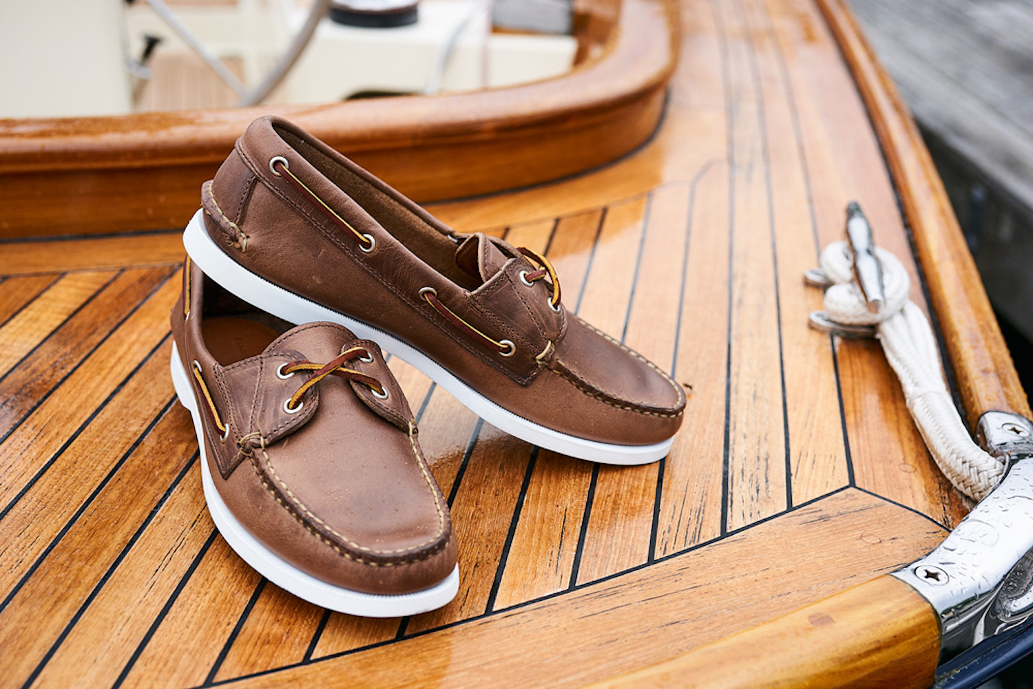 Pair of Rancourt loafers on the deck of a boat.