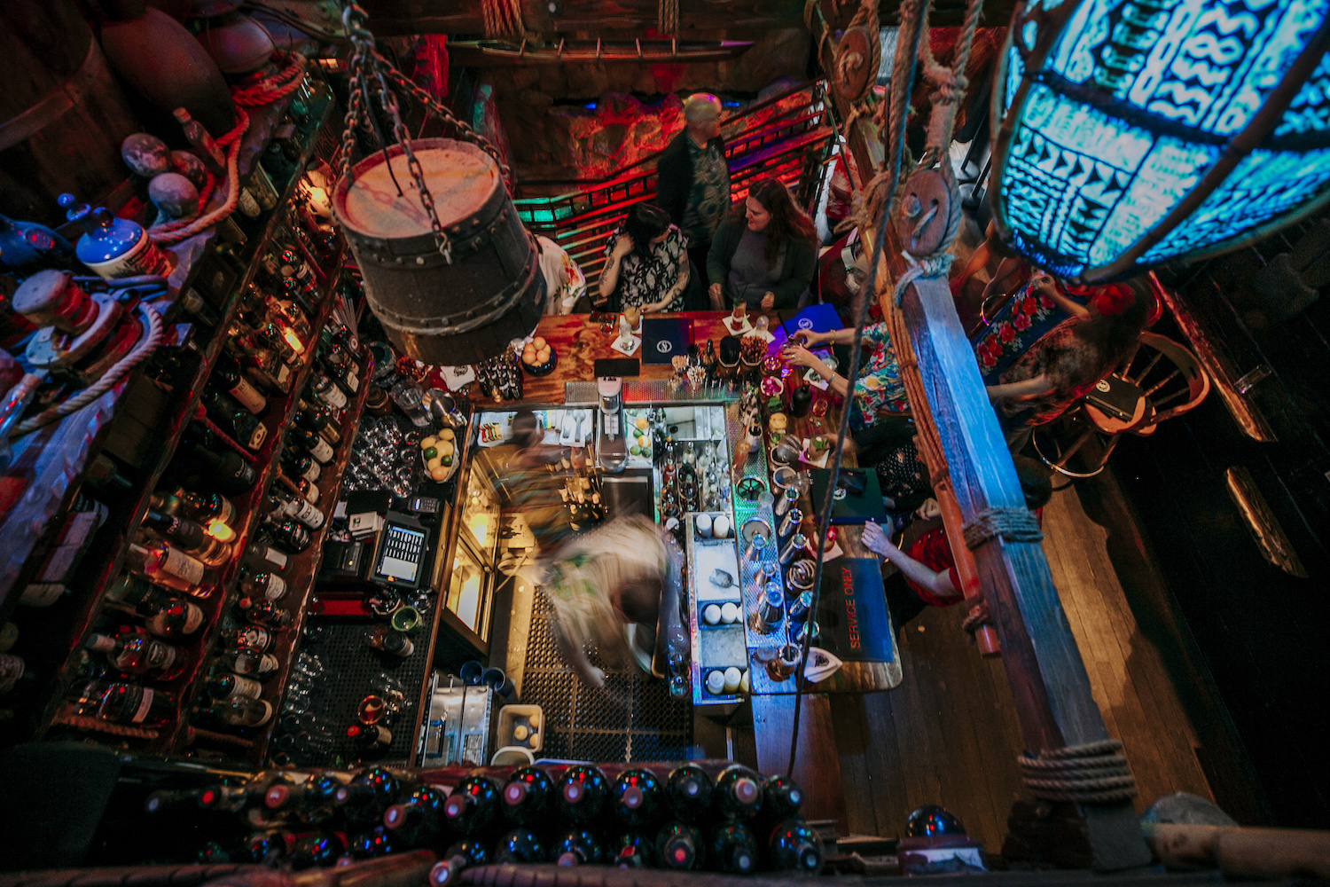Colorful birds-eye view over a square-shaped bar.