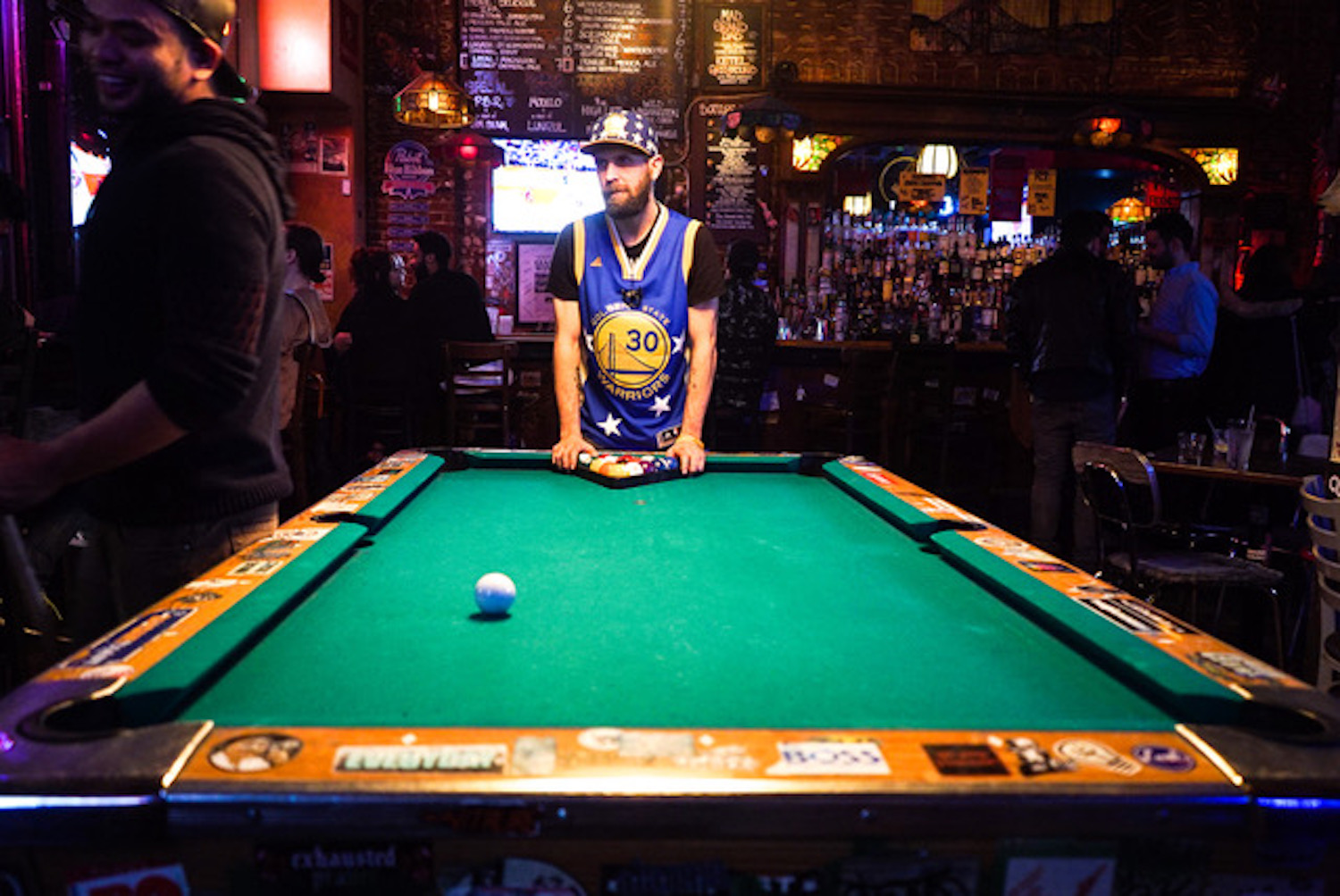 Guy standing at a pool table.