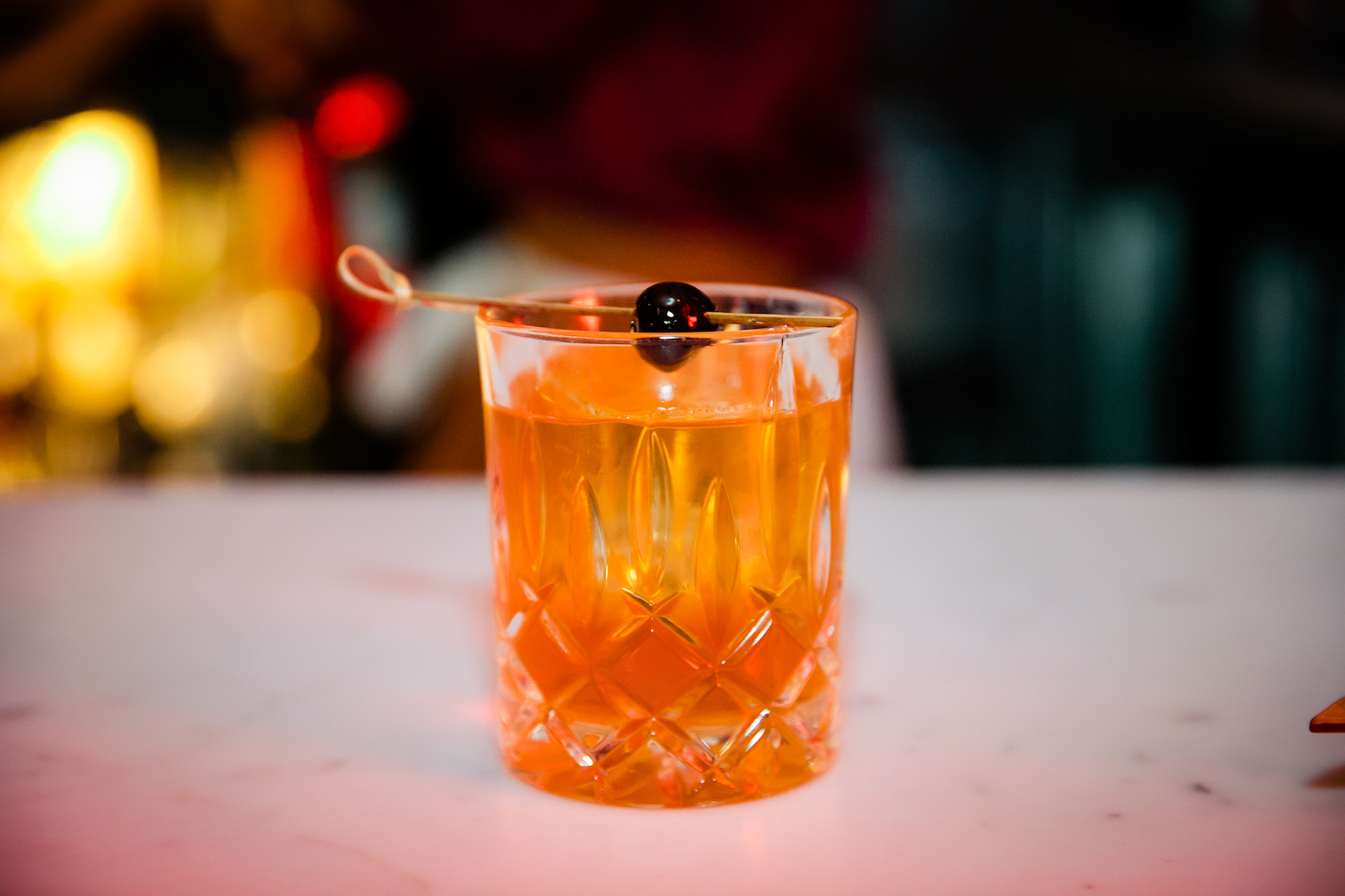 cocktail in a low-ball glass with a garnish