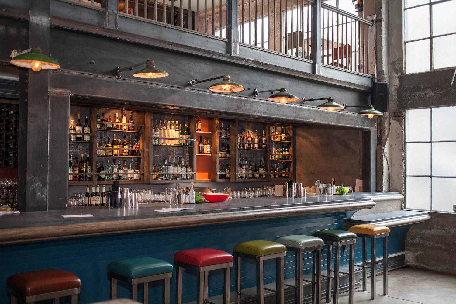 Bar with colorful stools.