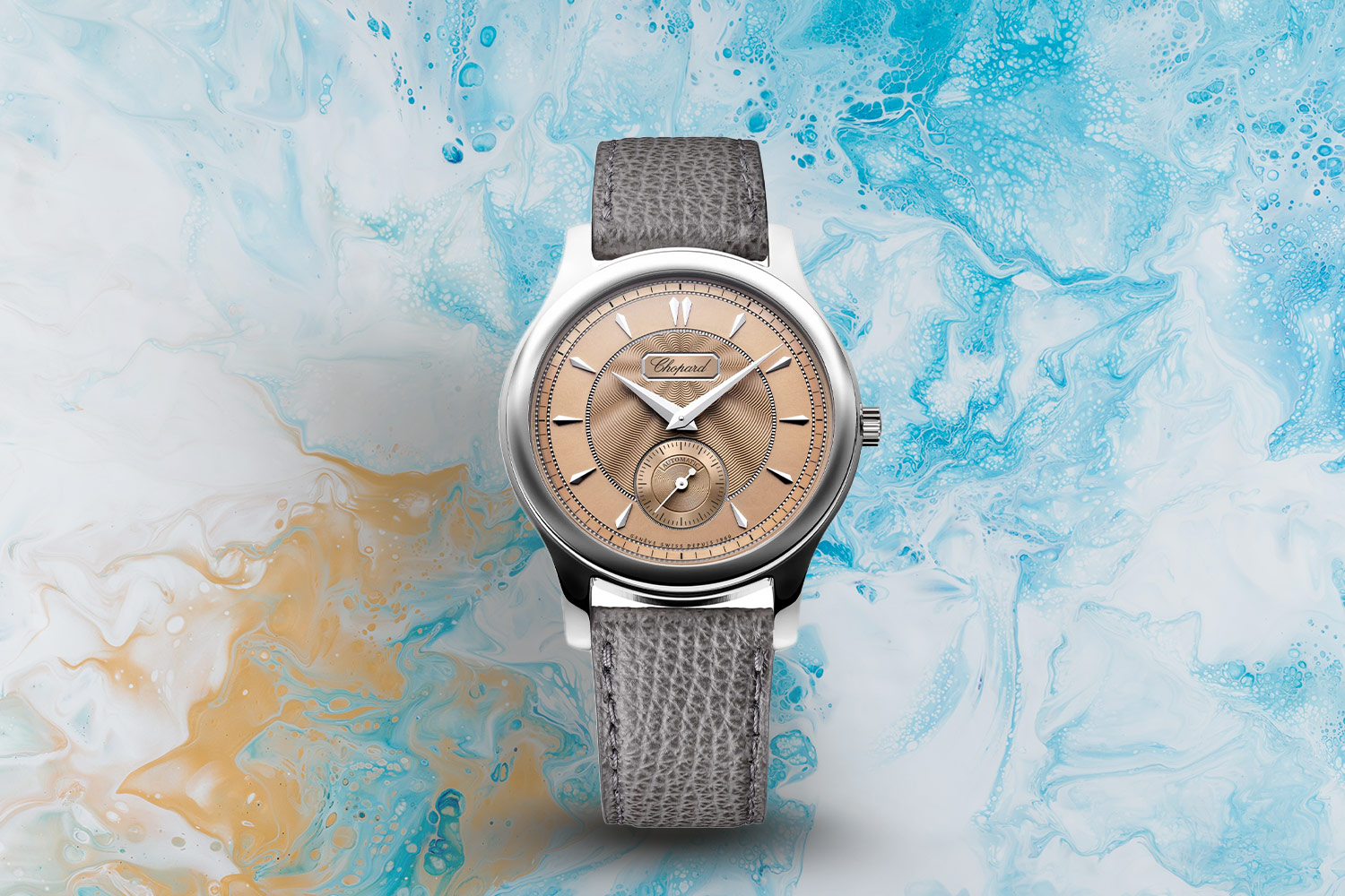 Gray, brown and silver watch.