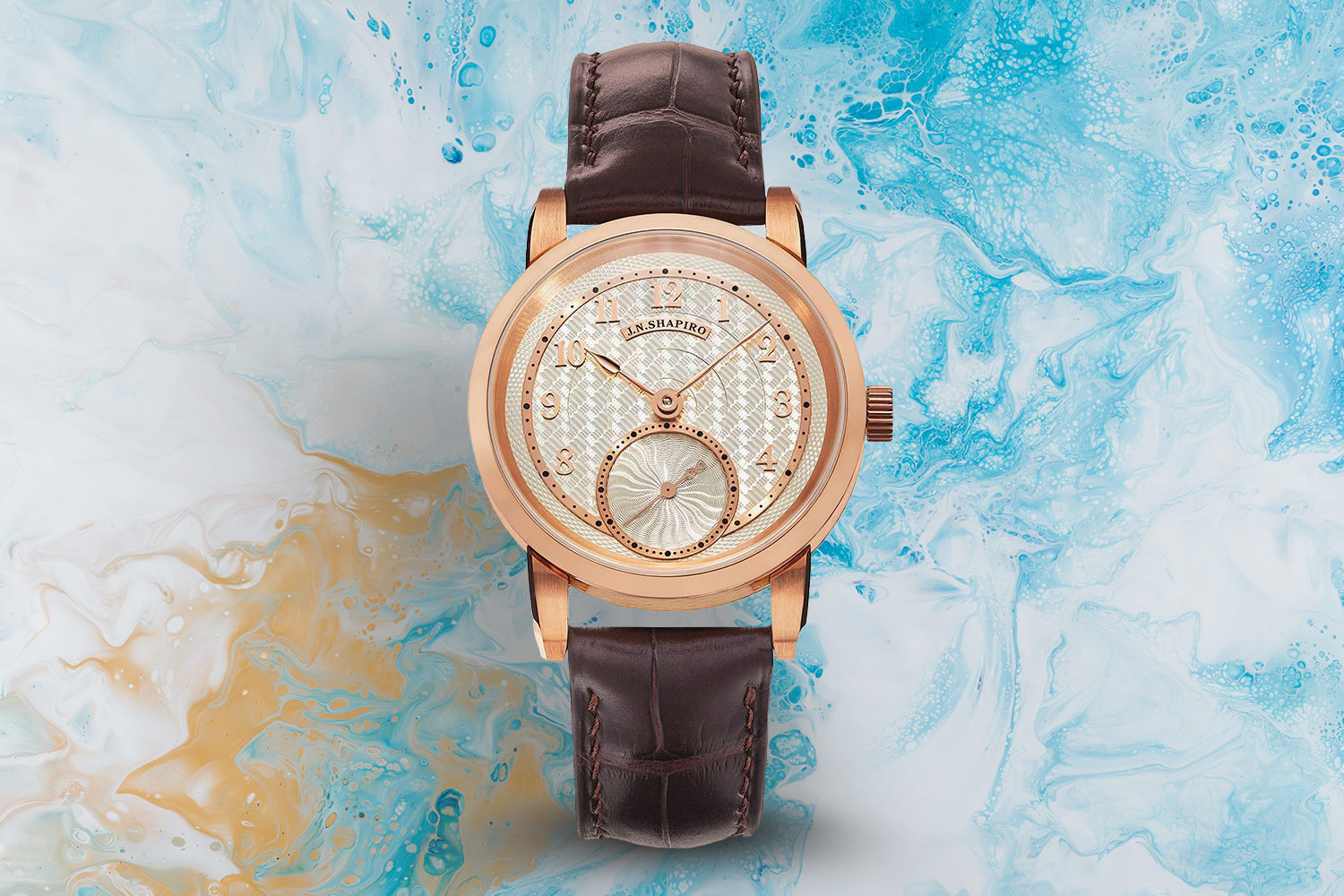 Brown, silver and cream-colored watch.