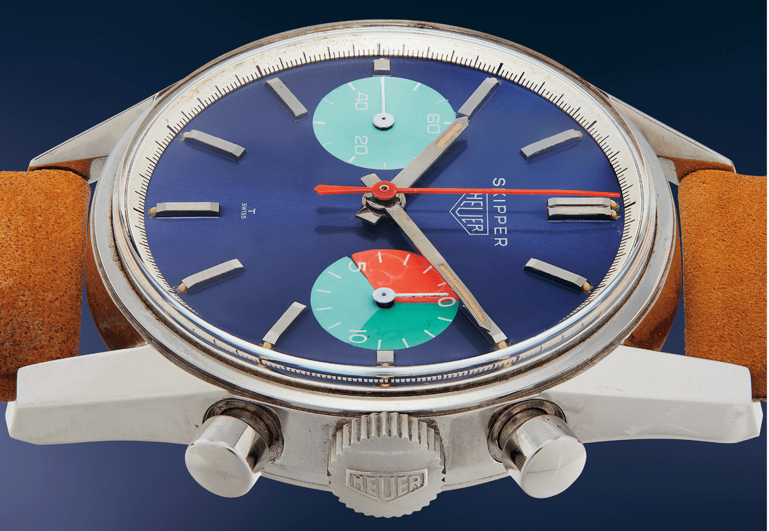 Brown watch with silver frame, blue face and turquoise and red accents.
