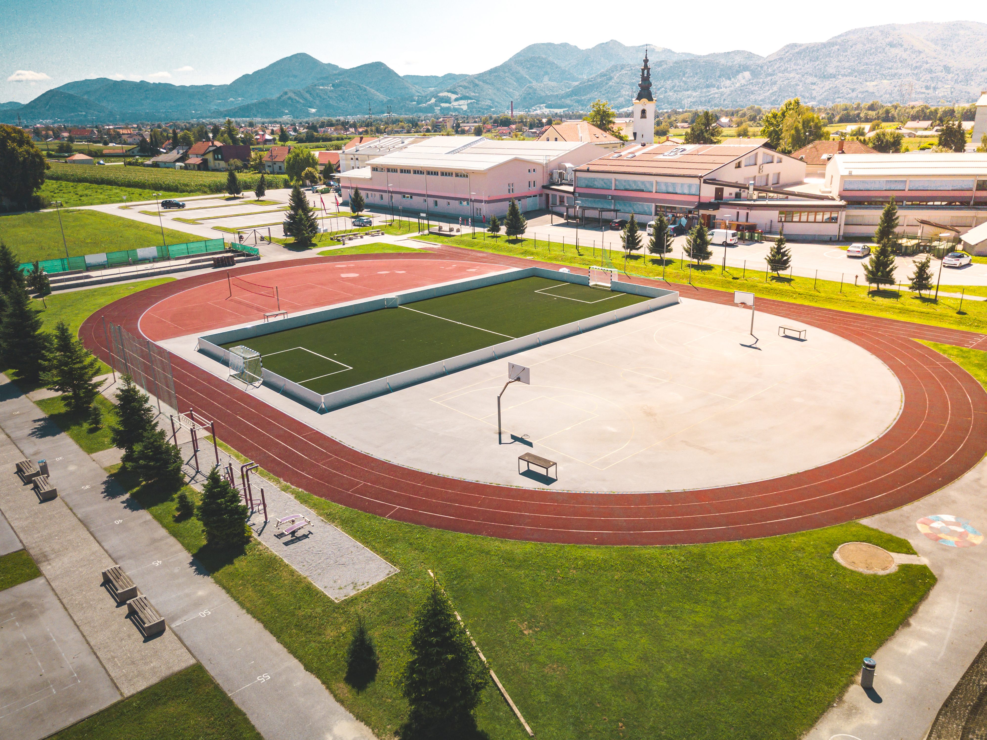 A view of a sports complex with various fields and courts.