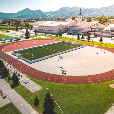 A view of a sports complex with various fields and courts.