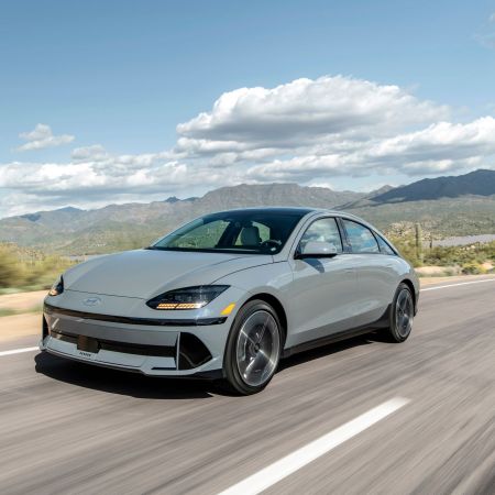 The 2023 Hyundai Ioniq 6 EV speeds across a roadway