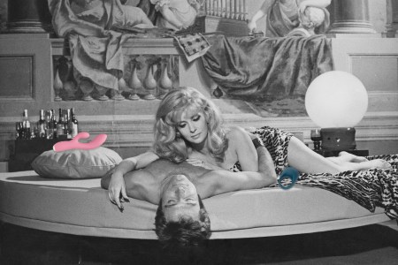 A man and woman lying on a bed together in black and white with vibrators pictured in color