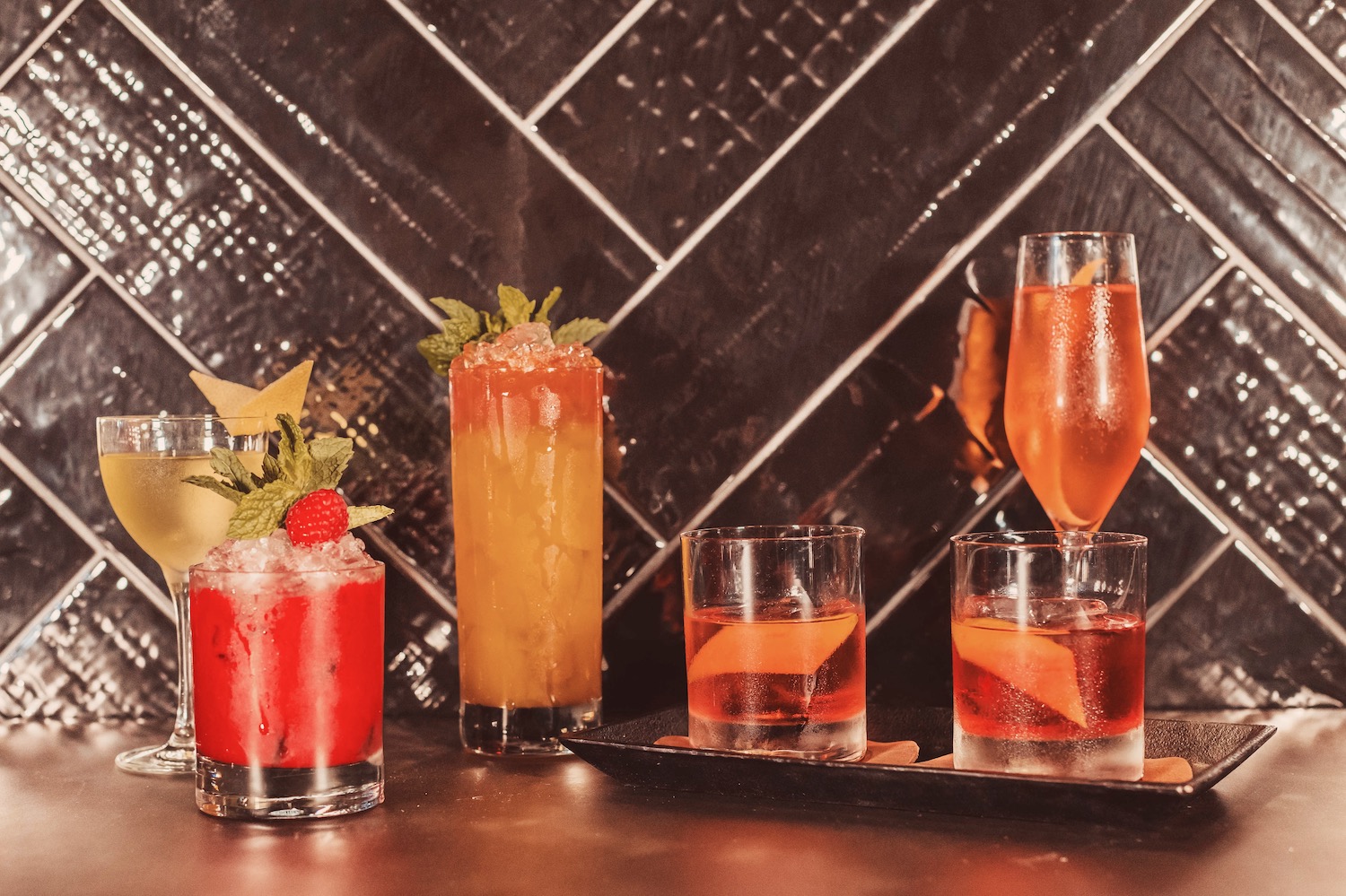 Spread of different kinds of cocktails on a table