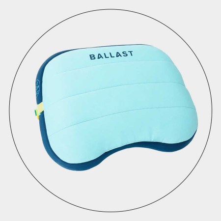 Ballast Beach Pillow in a circle on a grey background.