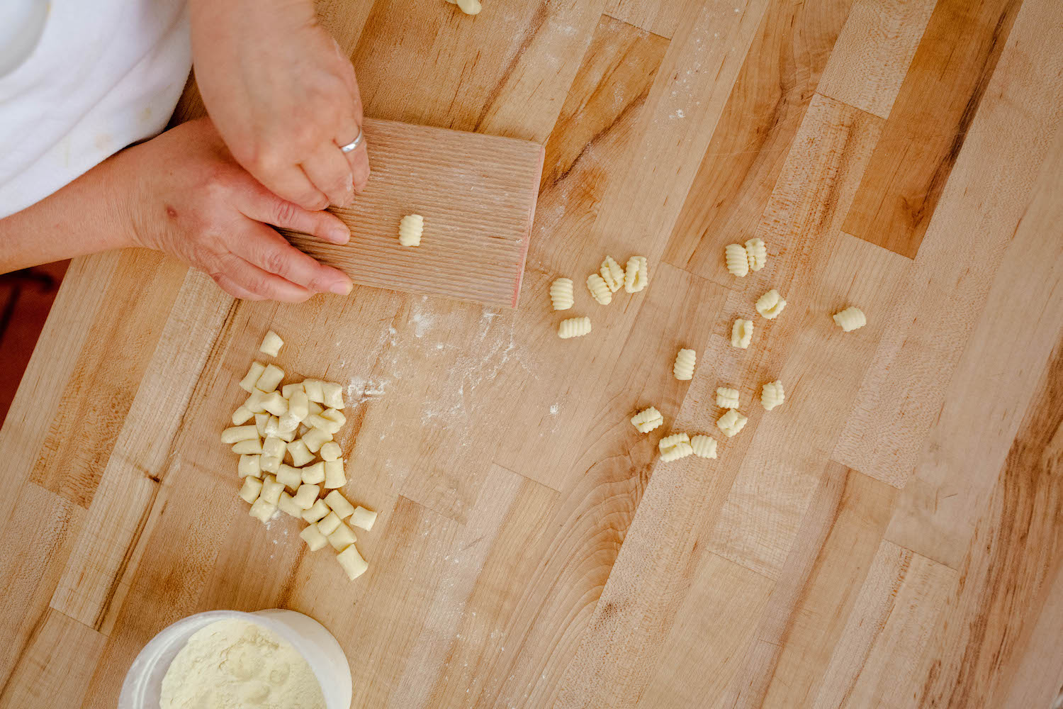 Rolling gnocchetti sardi on a wooden table