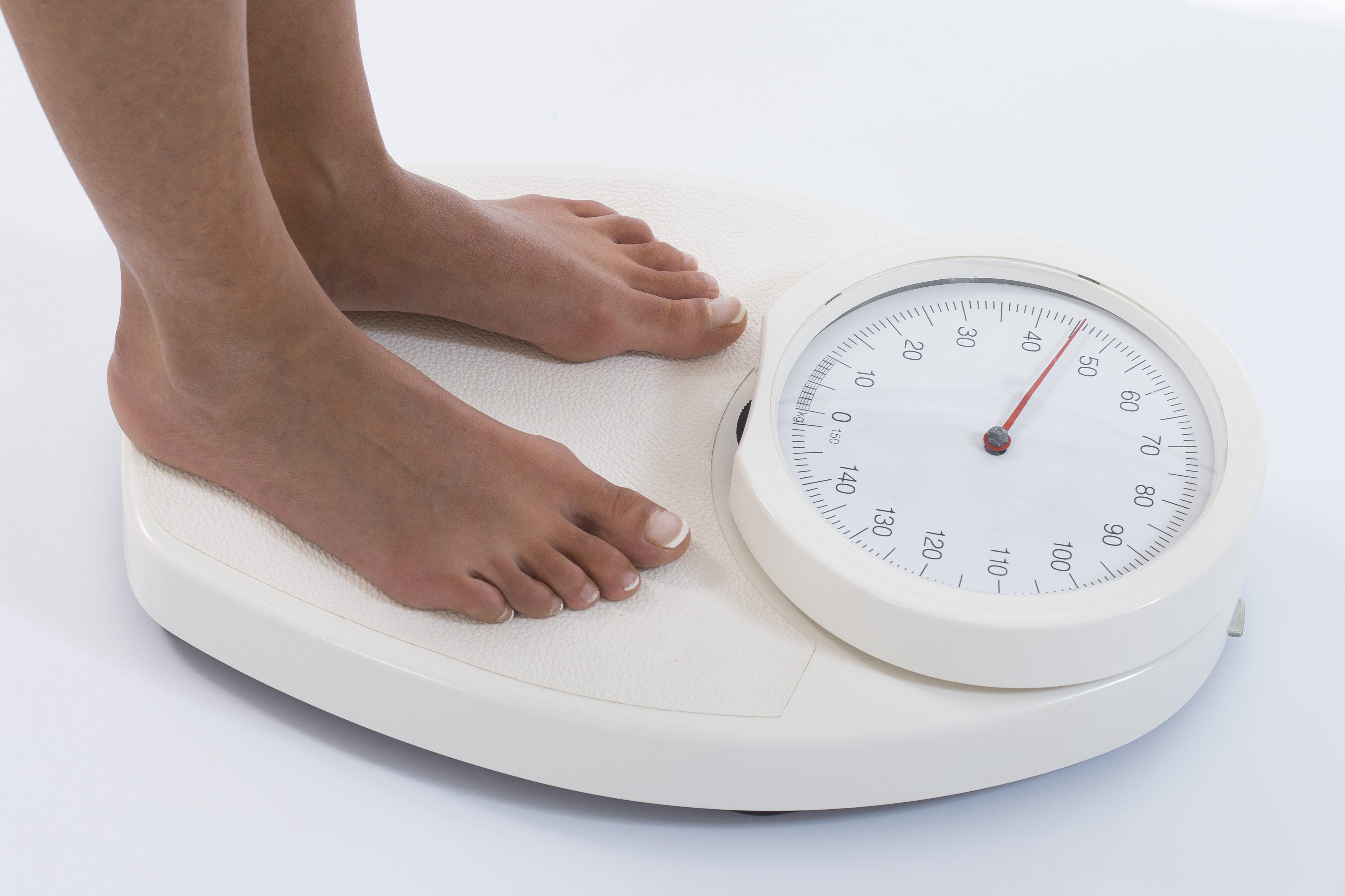 A woman's feet on a bathroom scale