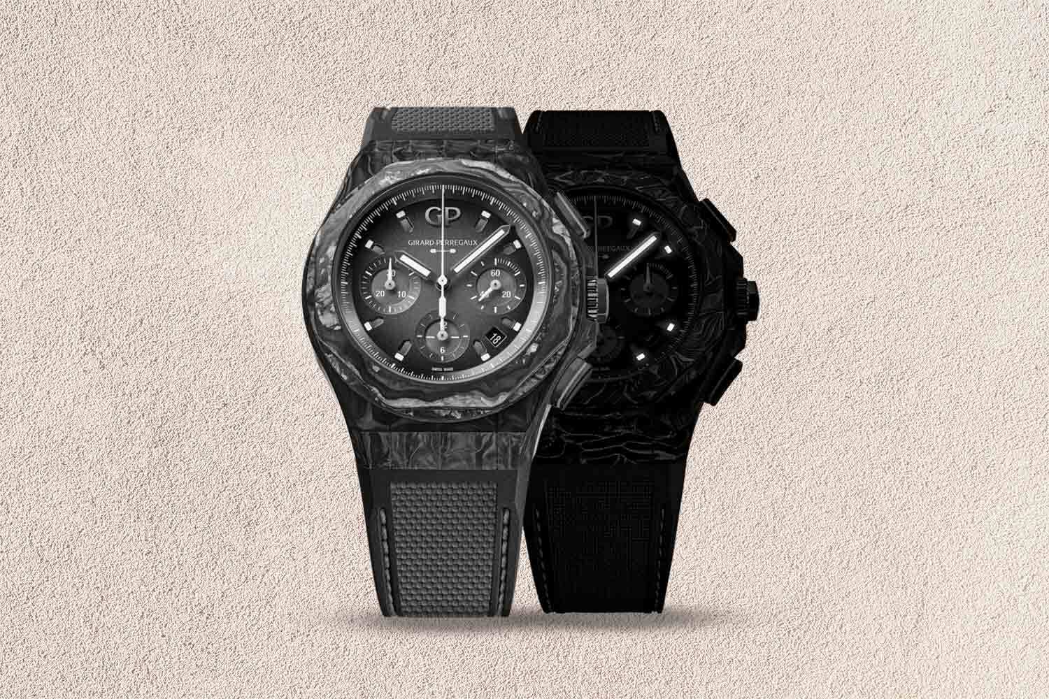 One lighter-colored black watch and one dark-colored black watch