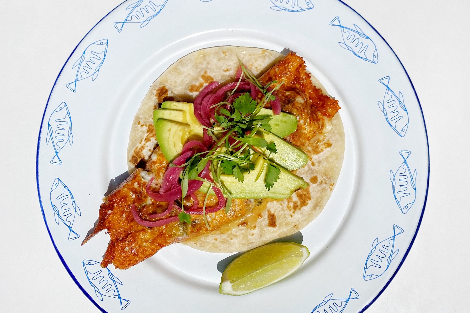 Una Costra Por Favor, with oaxaca cheese, gruyere cheese, pasilla chile, shrimp, flour tortilla and black beans