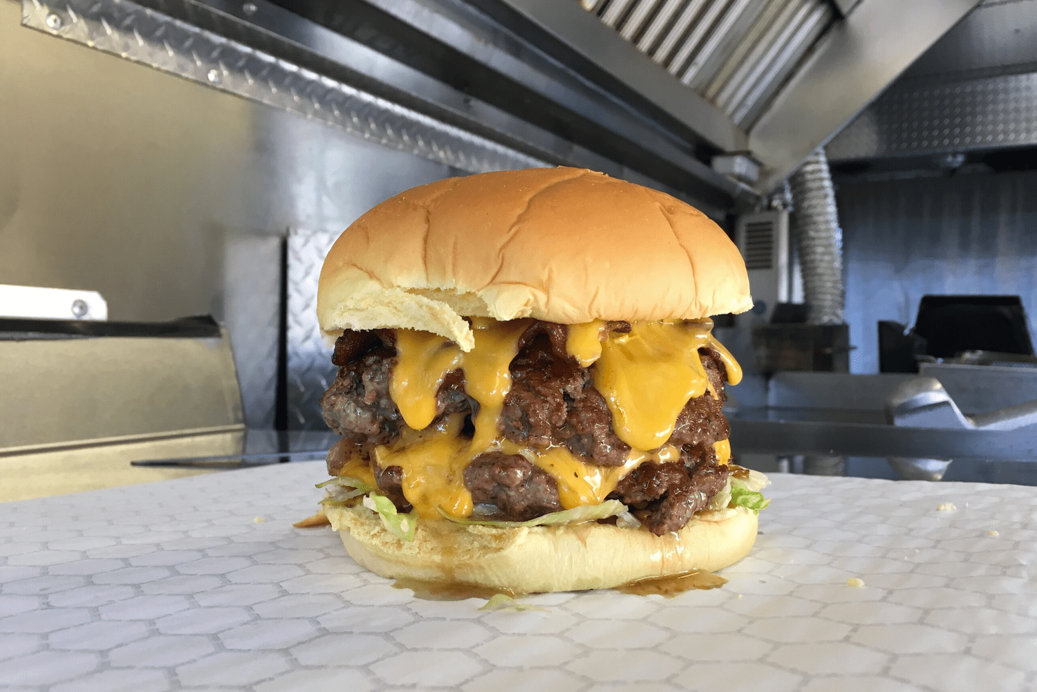 Double decker burger with drippy cheese