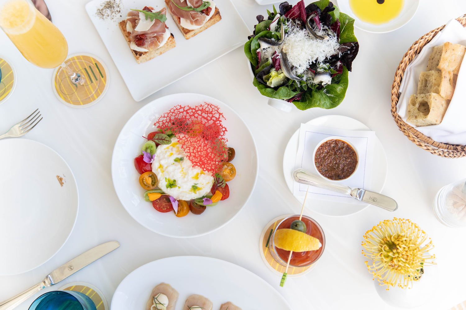 Brunch spread on white tables and plating