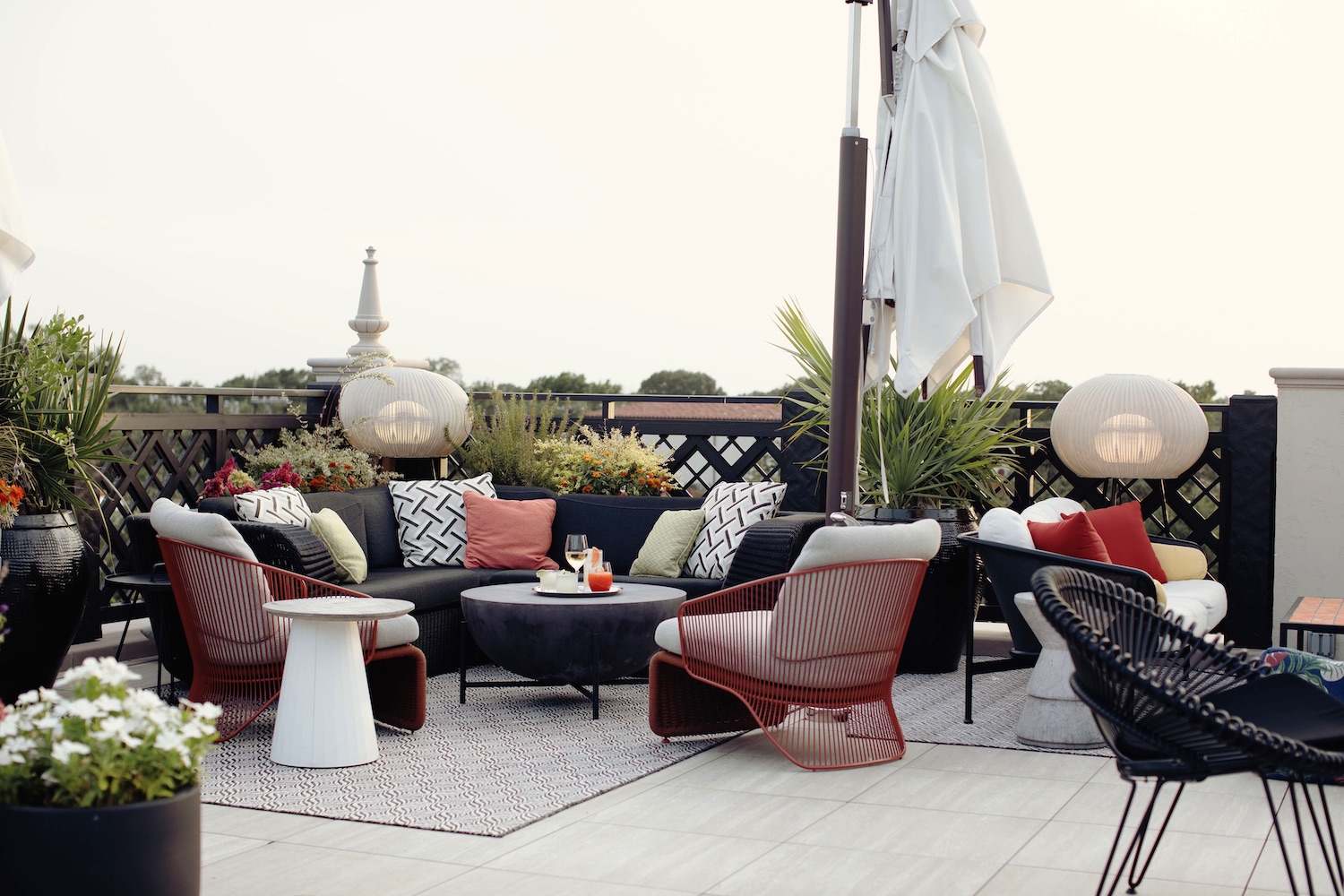 Outdoor seating area at Park House with couch seats and greenery