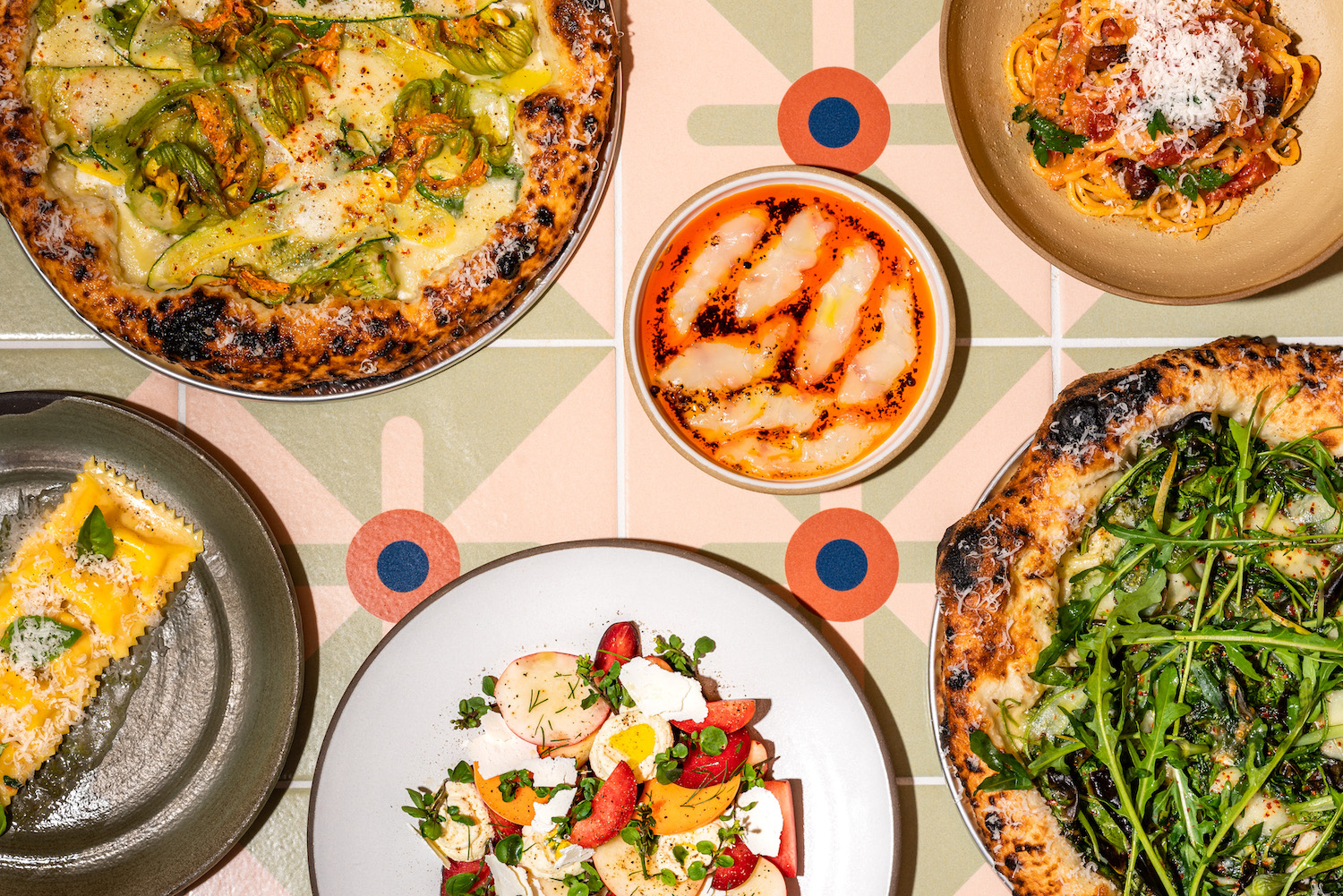 Array of small plates on a bright colored patterned table