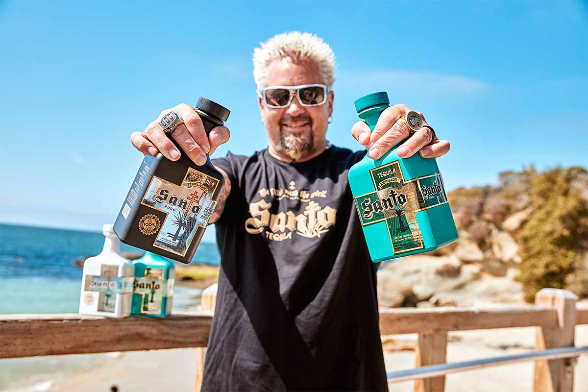 Santo Tequila and Guy Fieri on a beach boardwalk