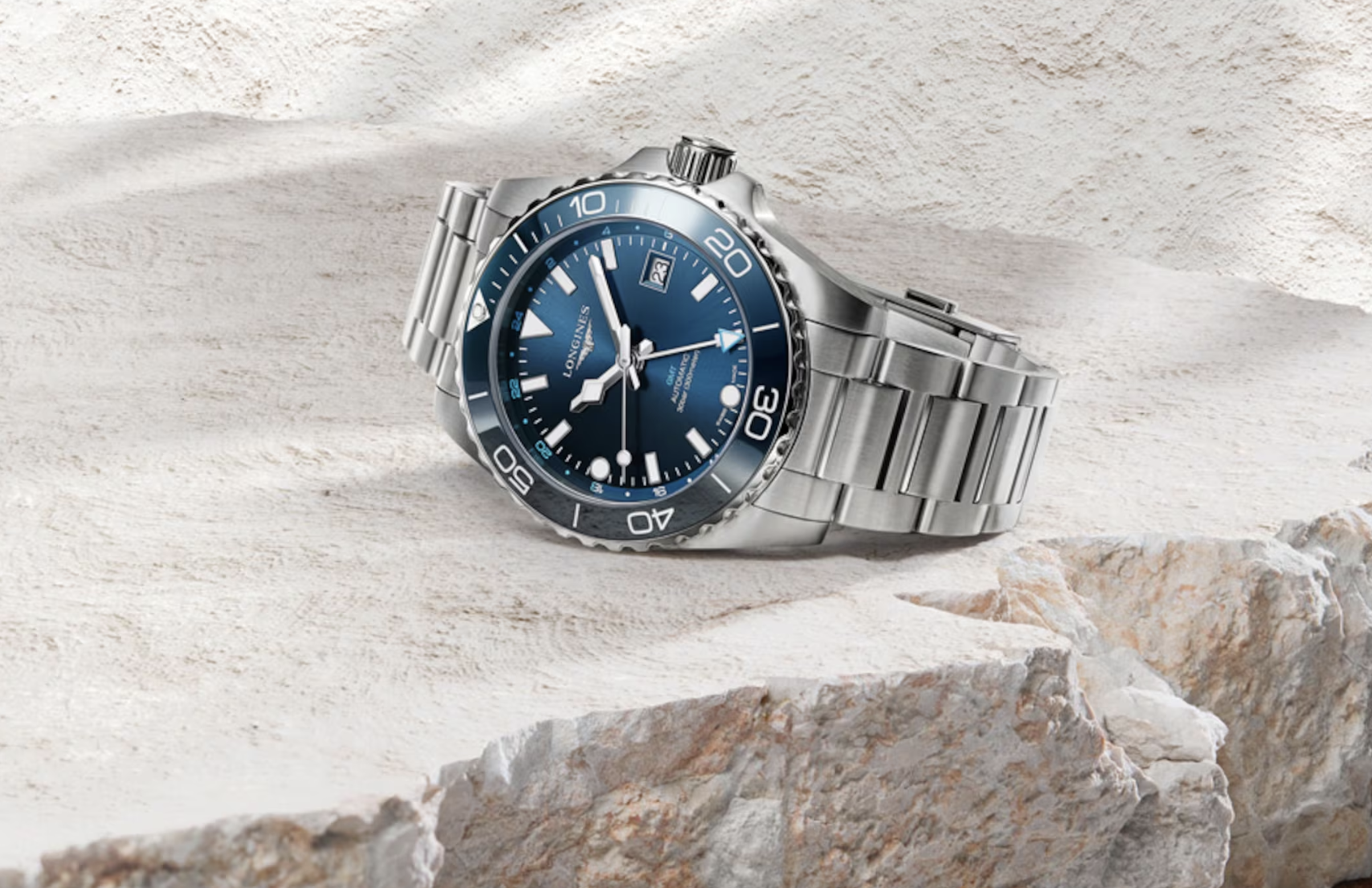 the Longines Hydroconquest GMT on a beige stone