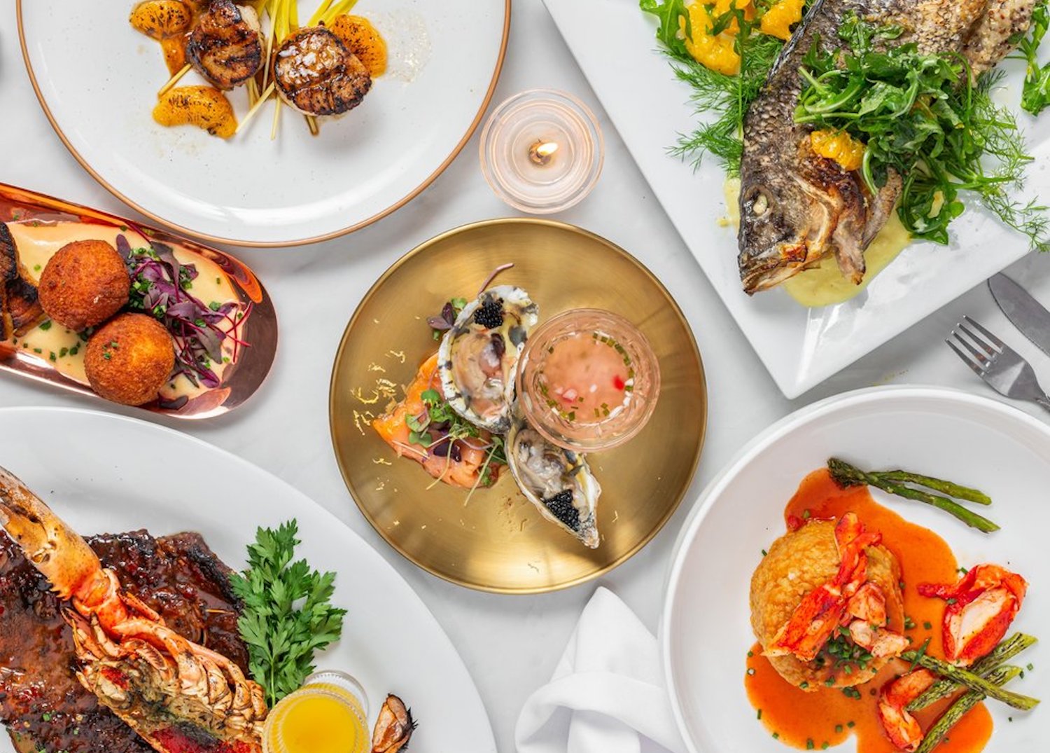 Variety of seafood on plates.