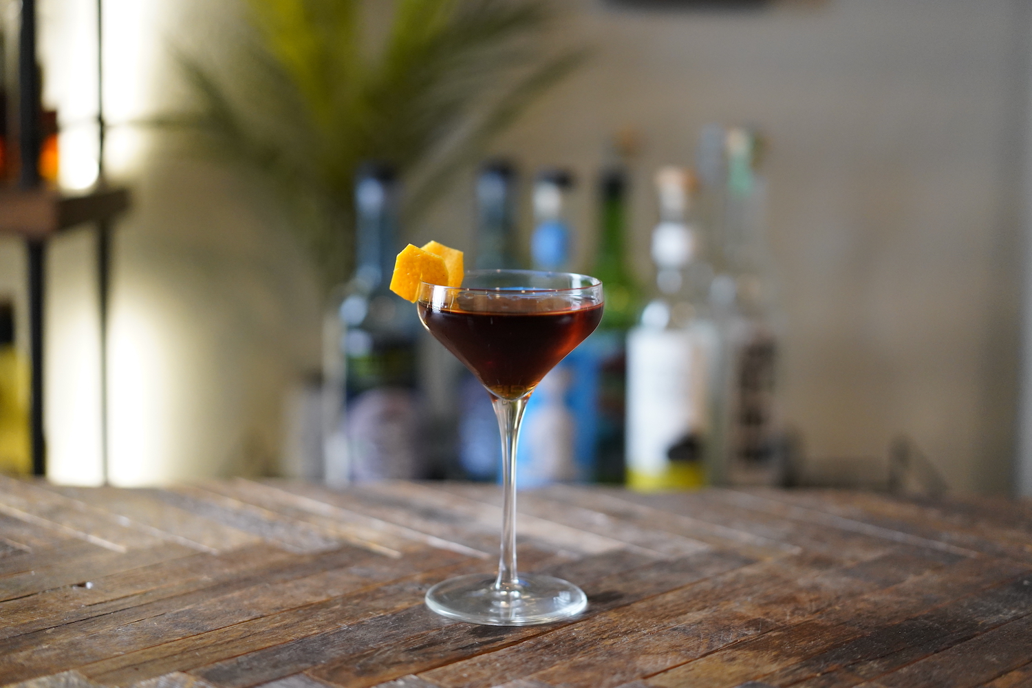 jaguar tequila cocktail in a coupe glass on a wooden table