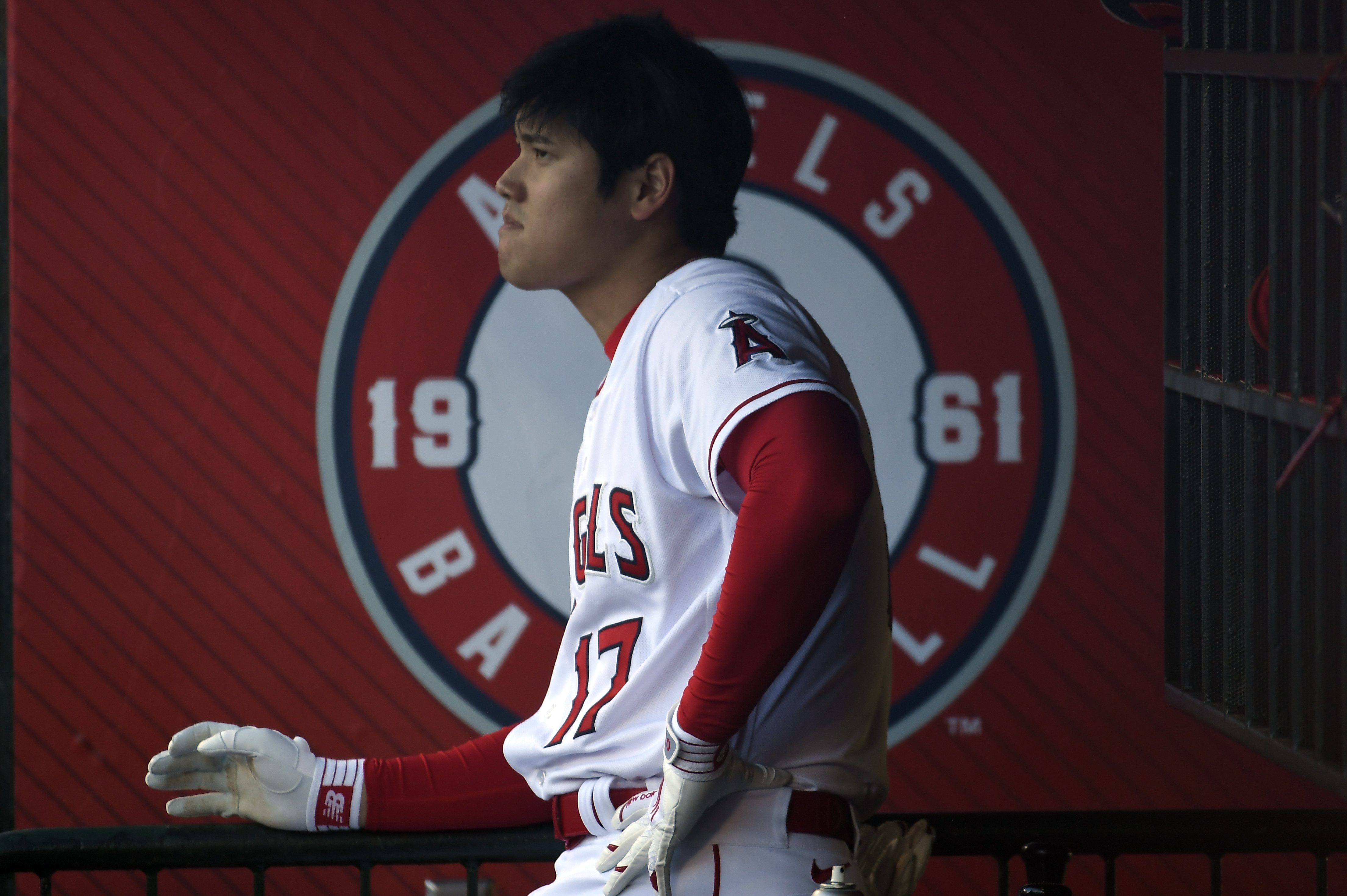 Shohei Ohtani looks on from the dugout.