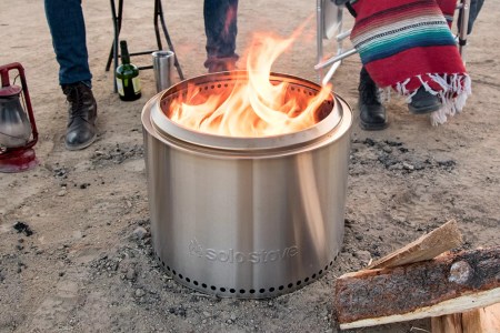 A bonfire pit from Solo Stove, on sale for Labor Day 2023, sitting on the beach