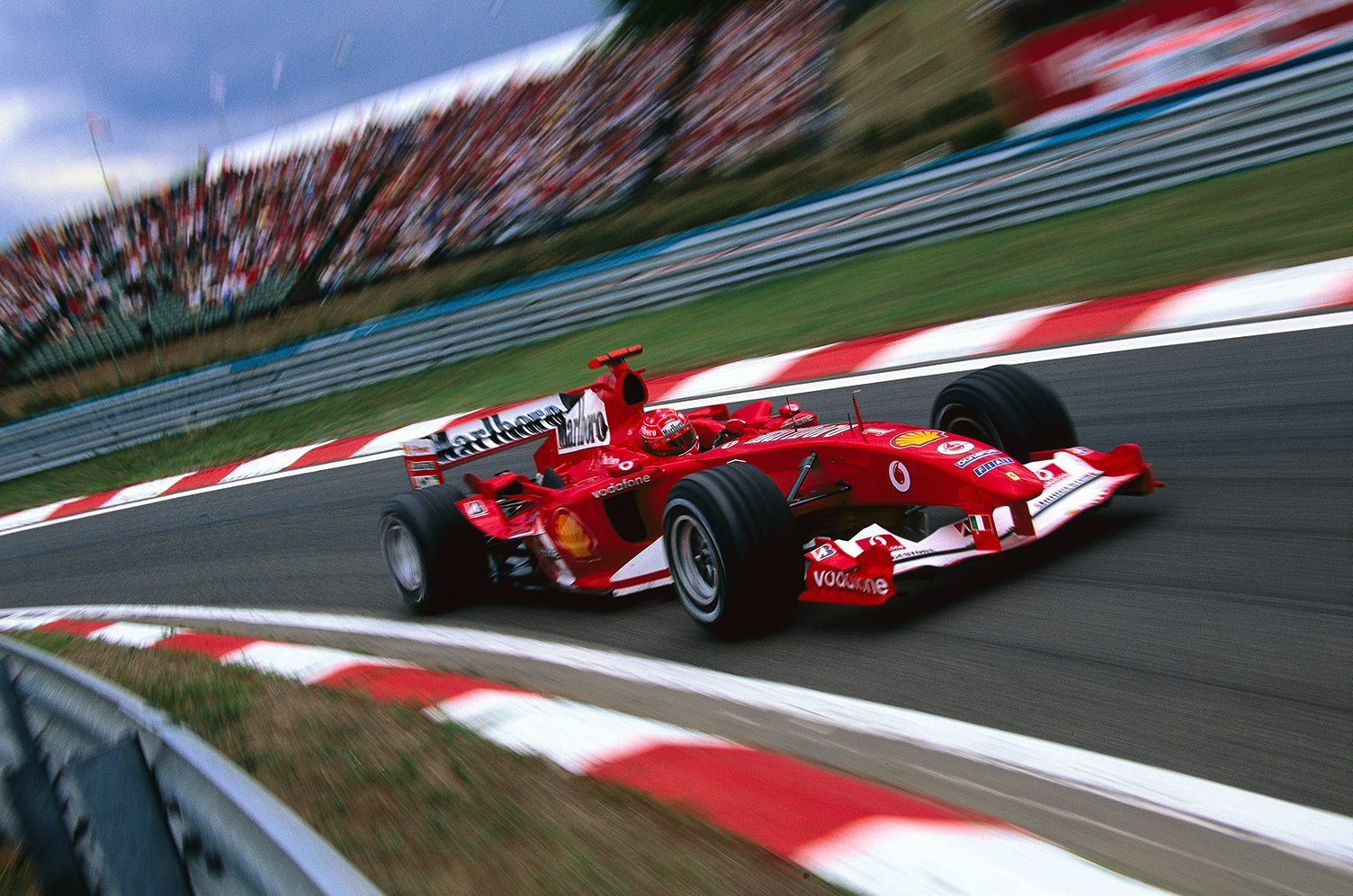 "We chose this as the front cover shot for the book as it says everything about the Scuderia; the color, passion, speed and style."