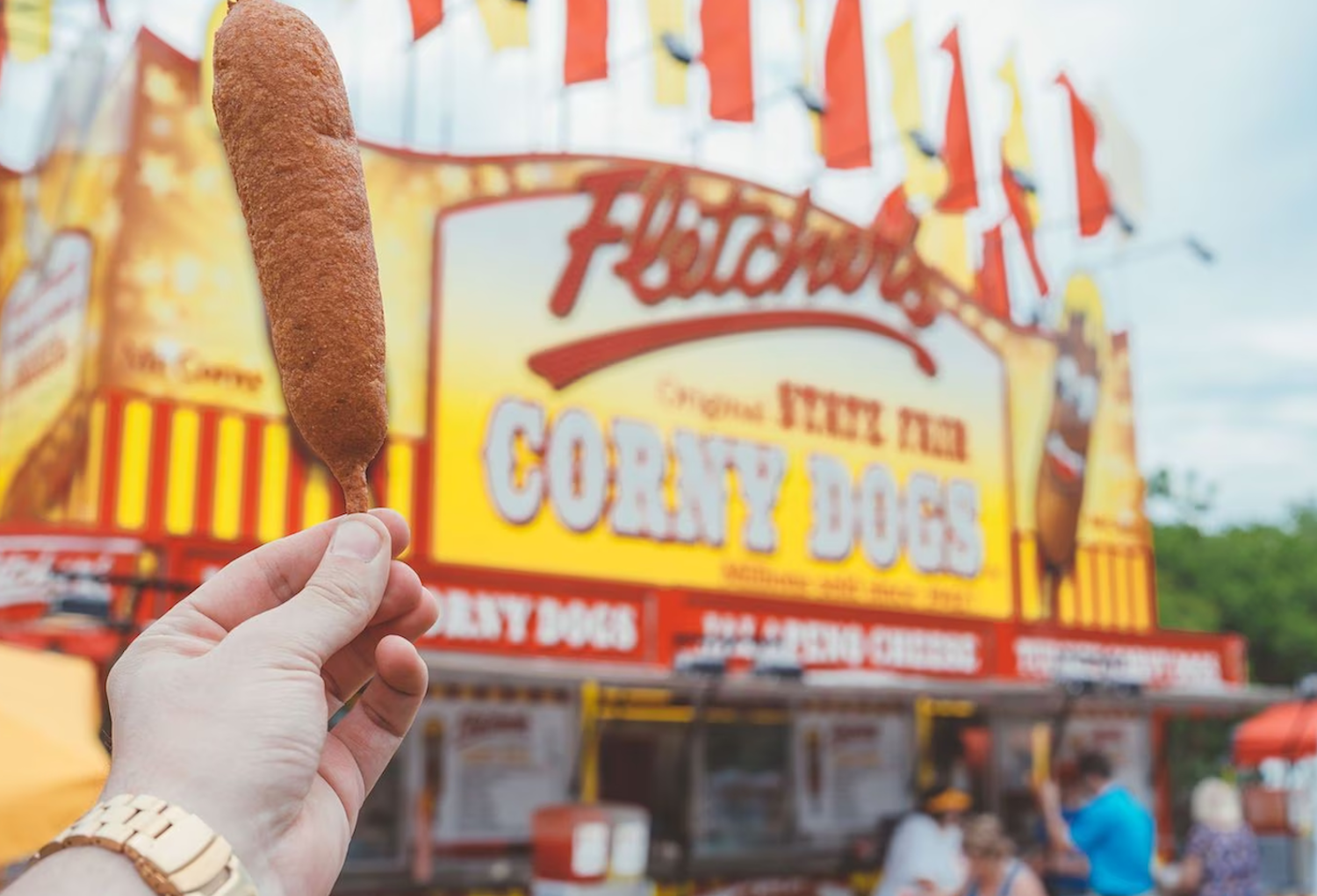 Corn dog being held outside of Fletcher's