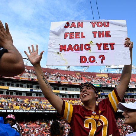 Commanders fan Logan Edwards celebrates after the game against the Arizona Cardinals at FedEx Field on September 10, 2023.