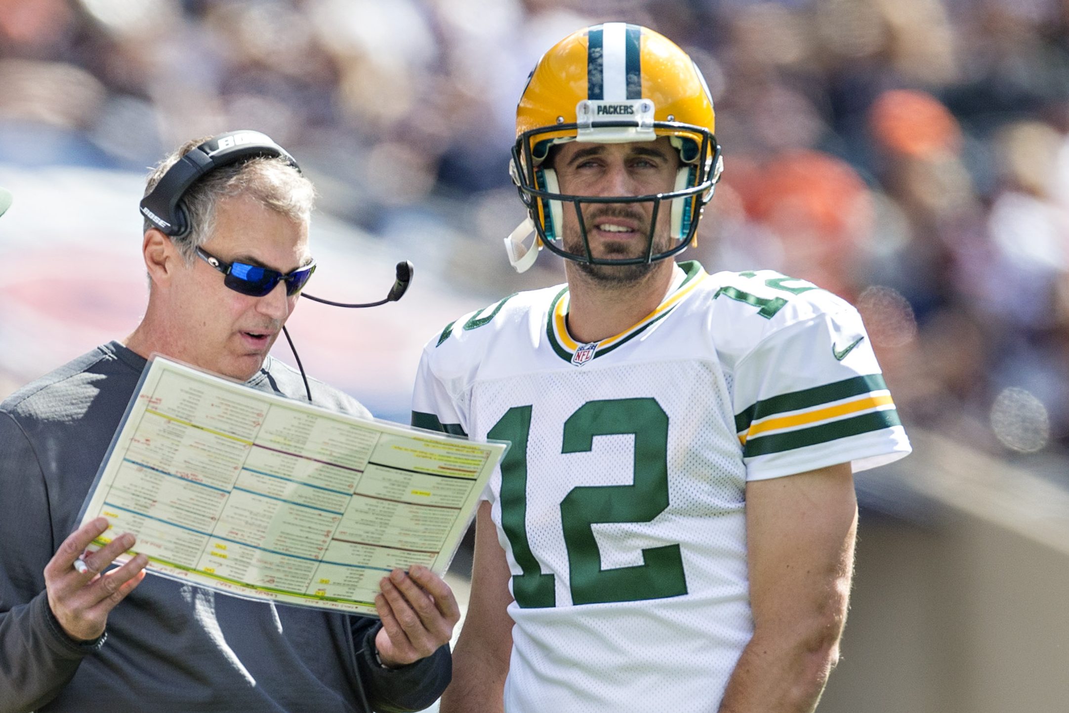 Tom Clements talks to Aaron Rodgers and Scott Tolzien.