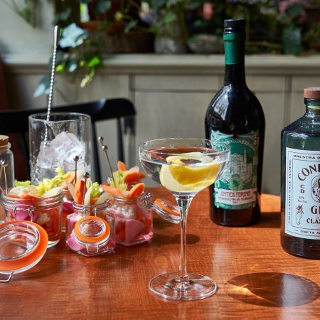 gramercy tavern Giardiniera marketini on a wooden table with gin and vermouth