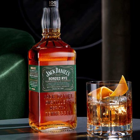 Jack Daniel's Bonded Rye, just released, with a whiskey cocktail on a table