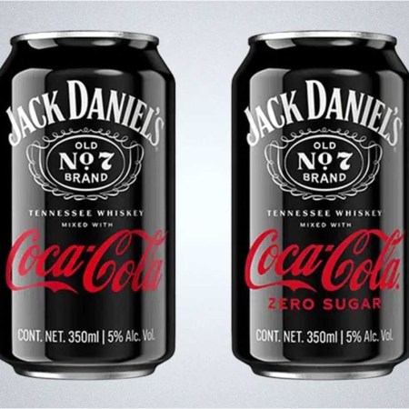 Two cans of the Jack Daniel's and Coca-Cola ready-to-drink (RTD), which has been a huge success for parent company Brown-Forman